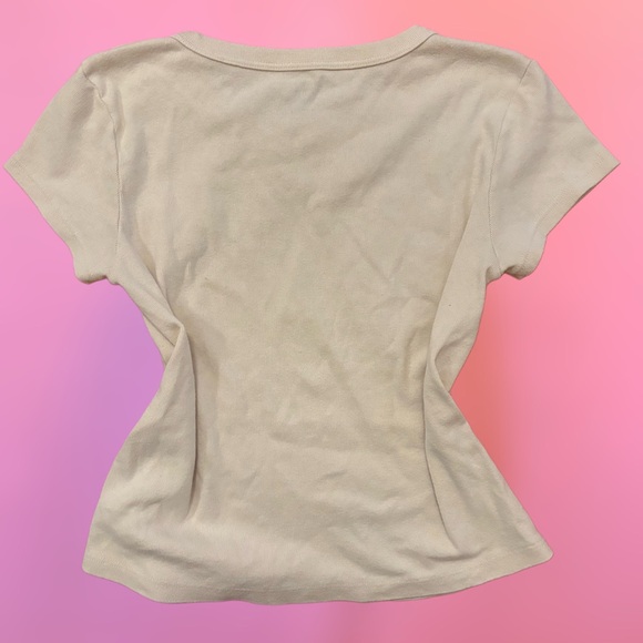 Brandy Melville Off White Creme “I don’t care” fairy graphic baby tee, small - Picture 5 of 7